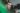man in green shirt wearing black framed eyeglasses